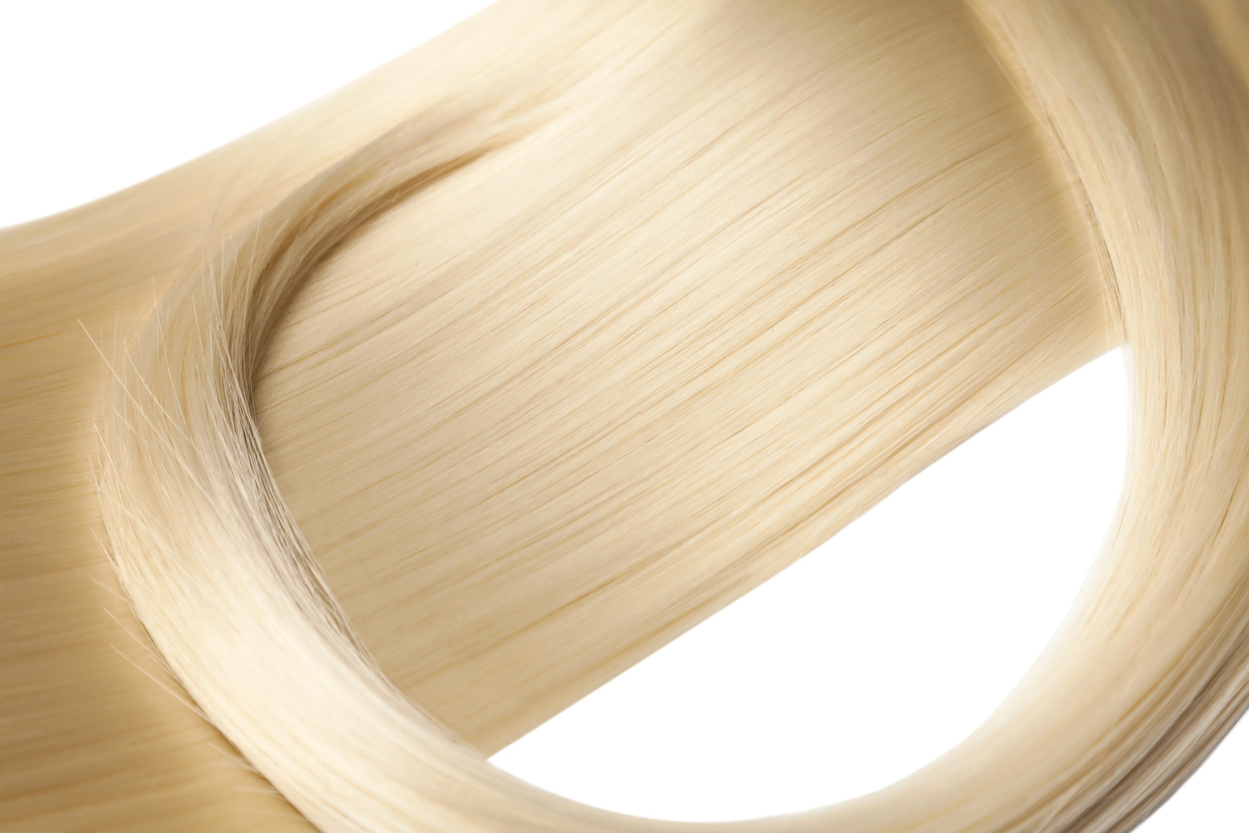 Hair with silicone coating for extra shine and gloss.