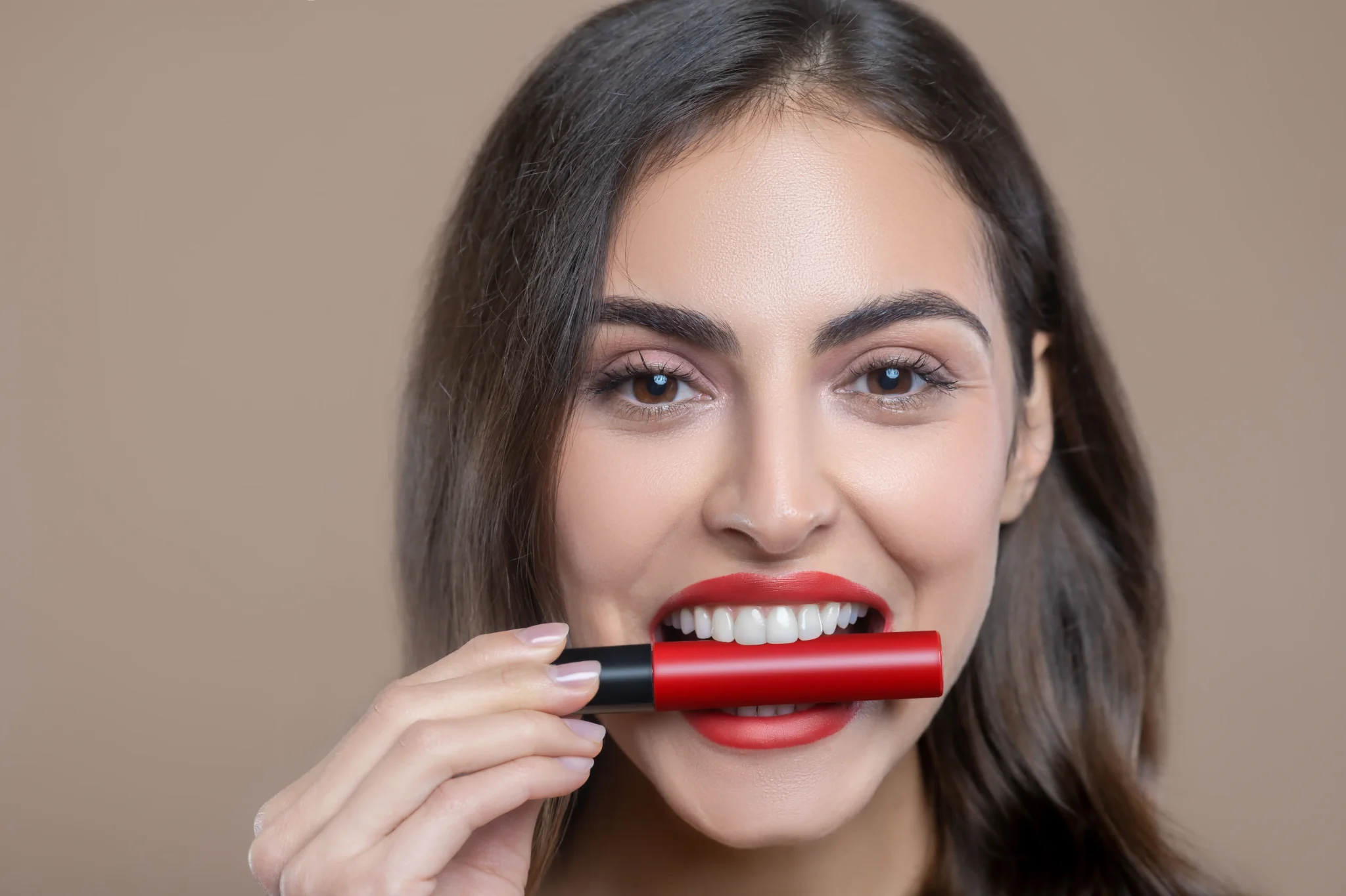 Lipstick hacks and colors that give thin lips a fuller appearance.