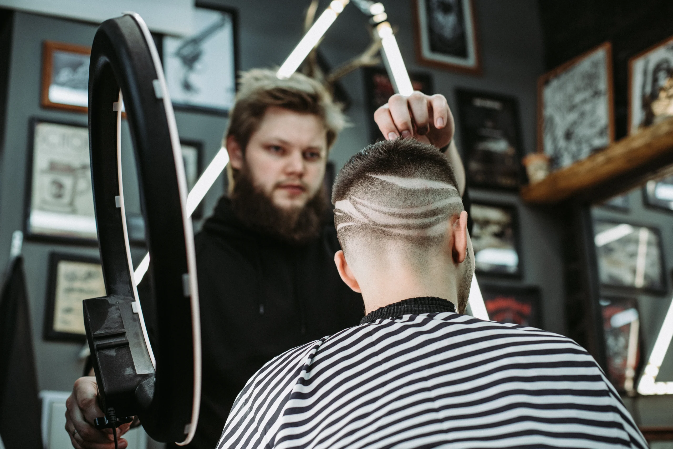 Modern geometric fade haircut showcasing artistic men’s grooming and masculine style.