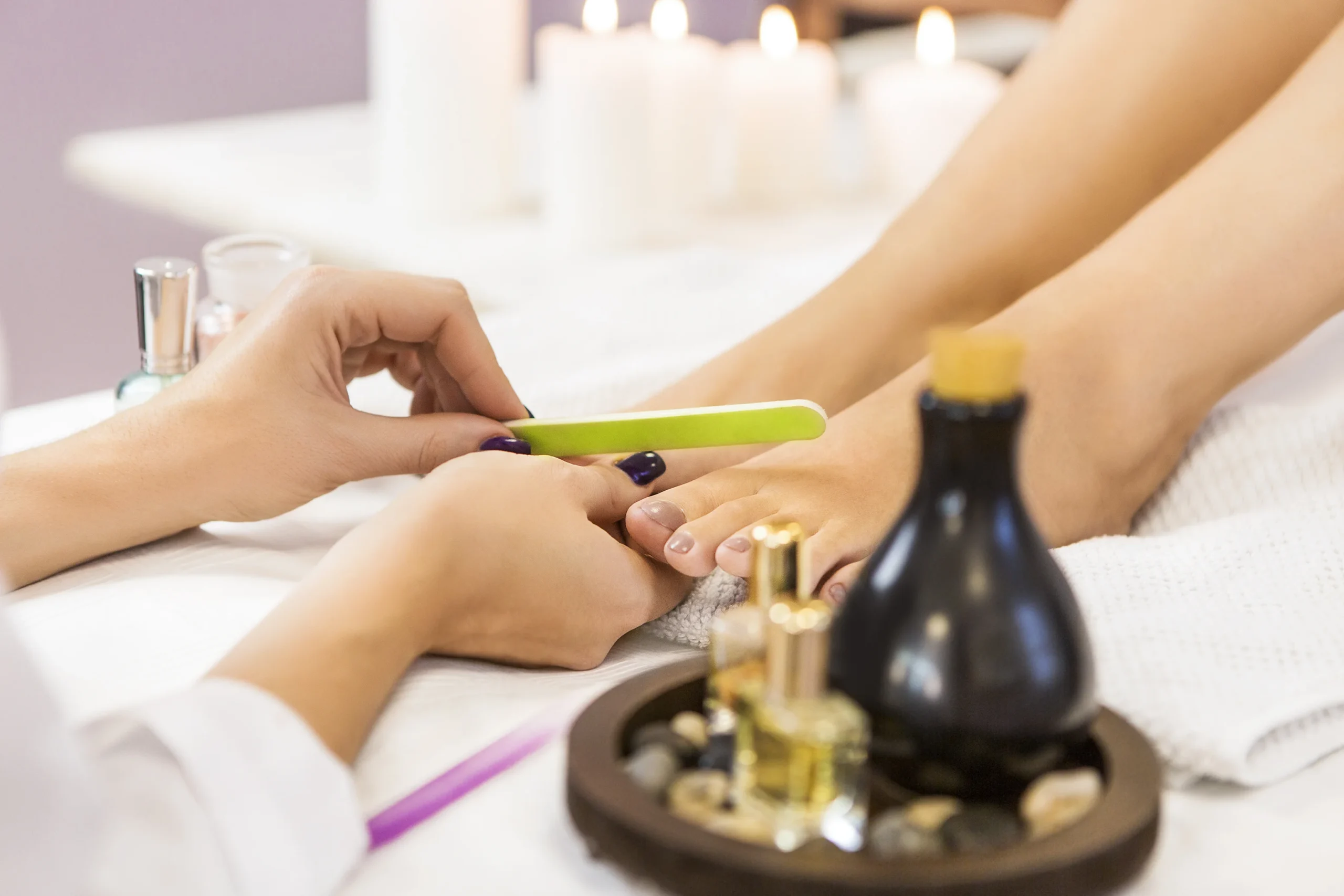 Woman enjoying relaxing hand and foot spa session