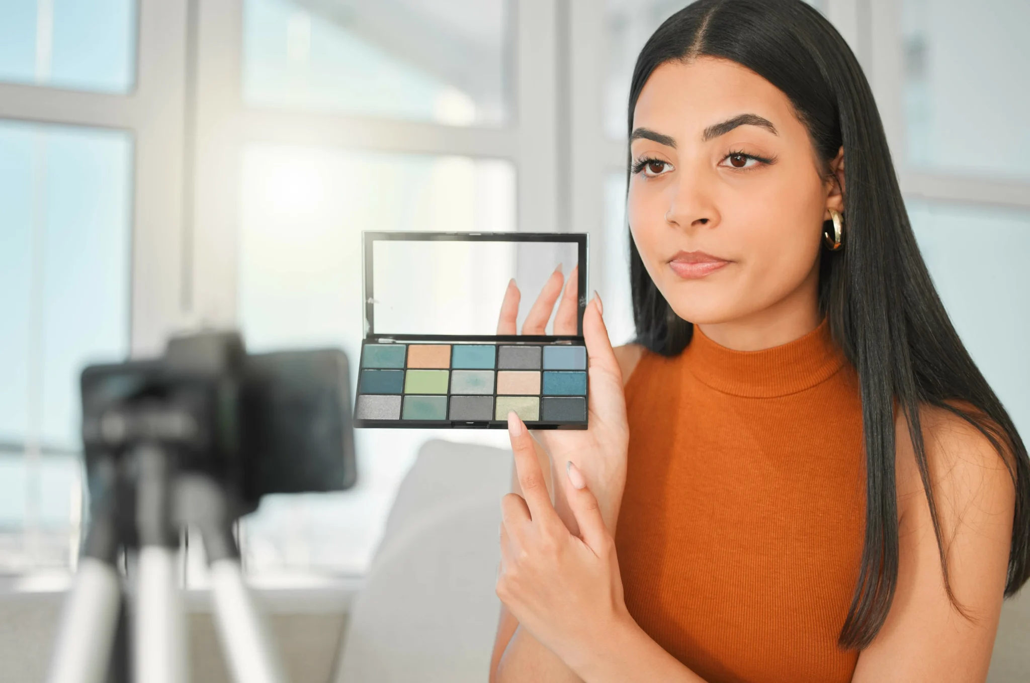 Beginner learning color correction makeup using green, peach, and lavender correctors