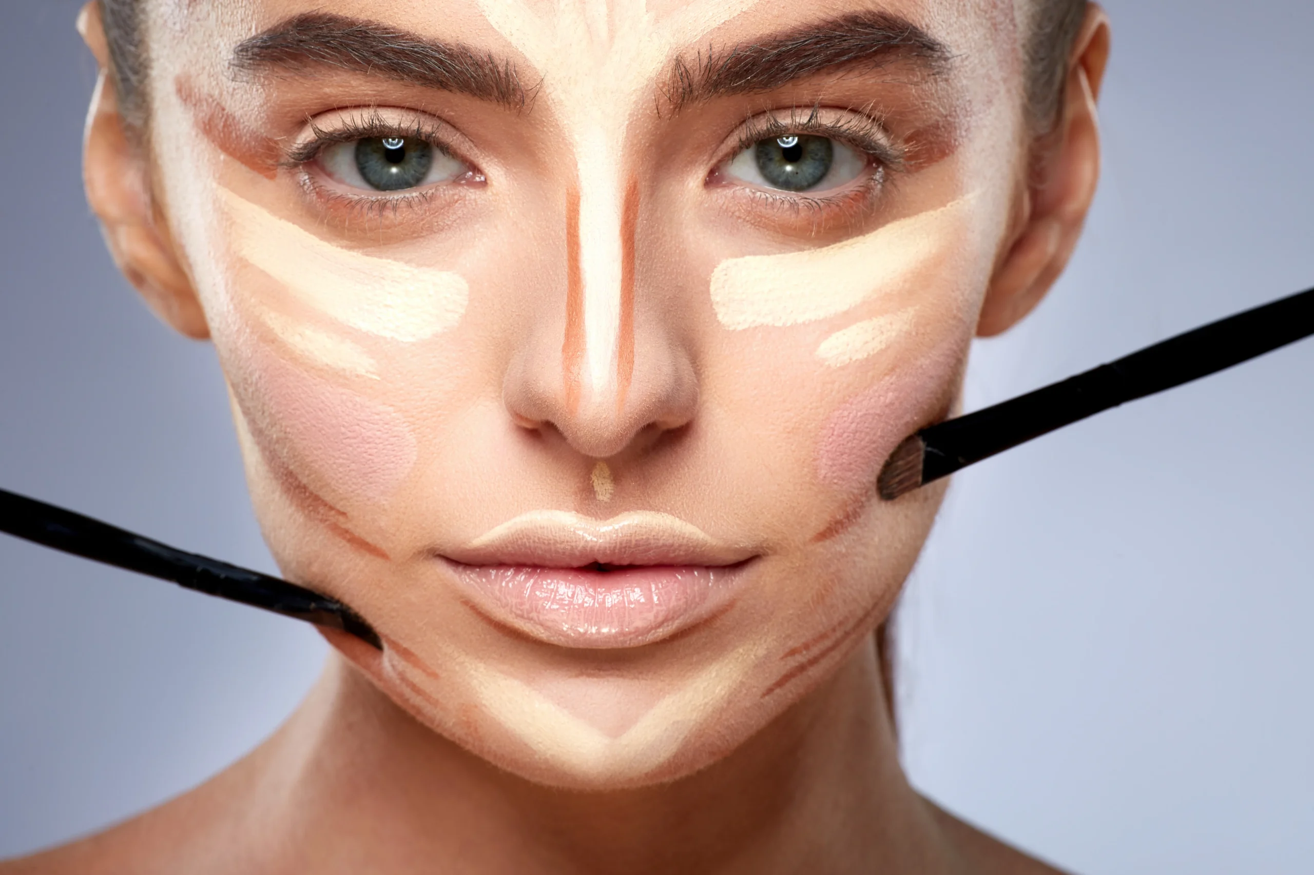 Contour lines applied under cheekbones for definition.
