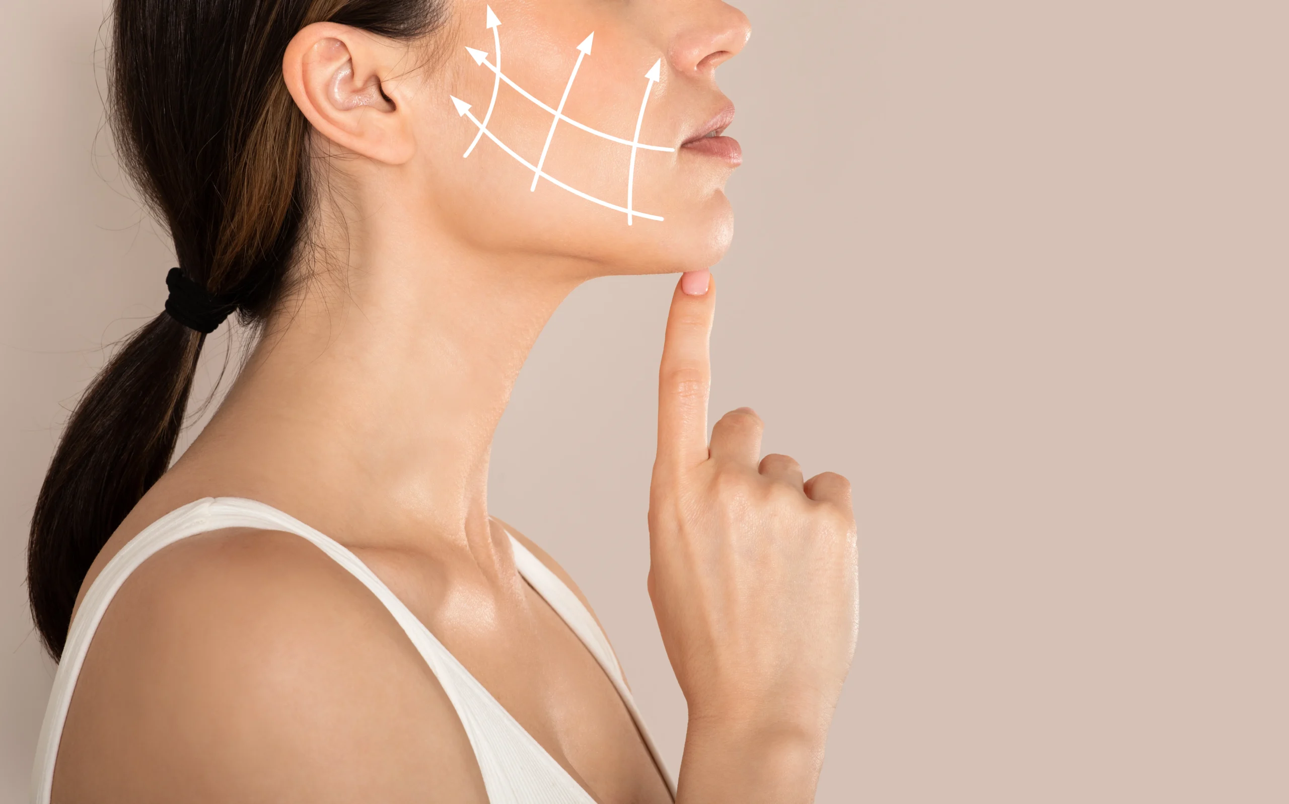 Jawline contour makeup being applied for sculpting effect.