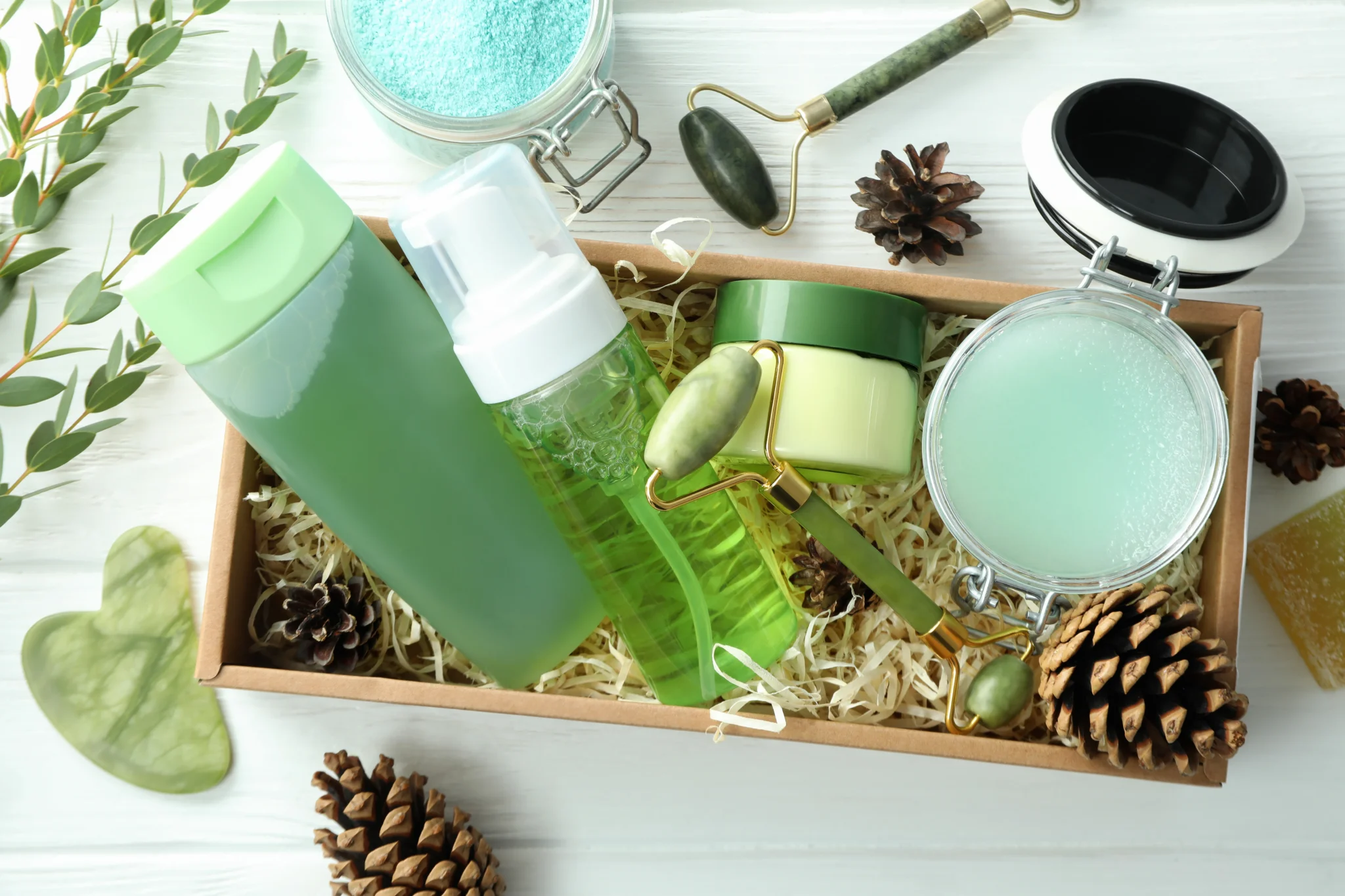 Natural skincare and wellness set with jade roller and green beauty products promoting relaxation.