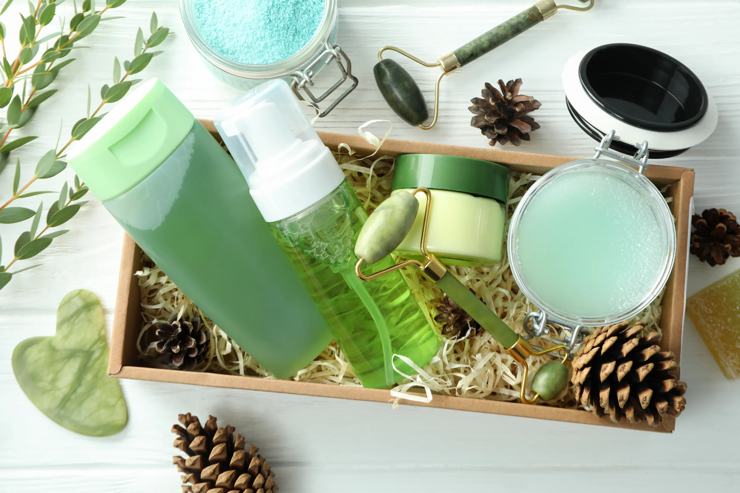 Natural skincare and wellness set with jade roller and green beauty products promoting relaxation.